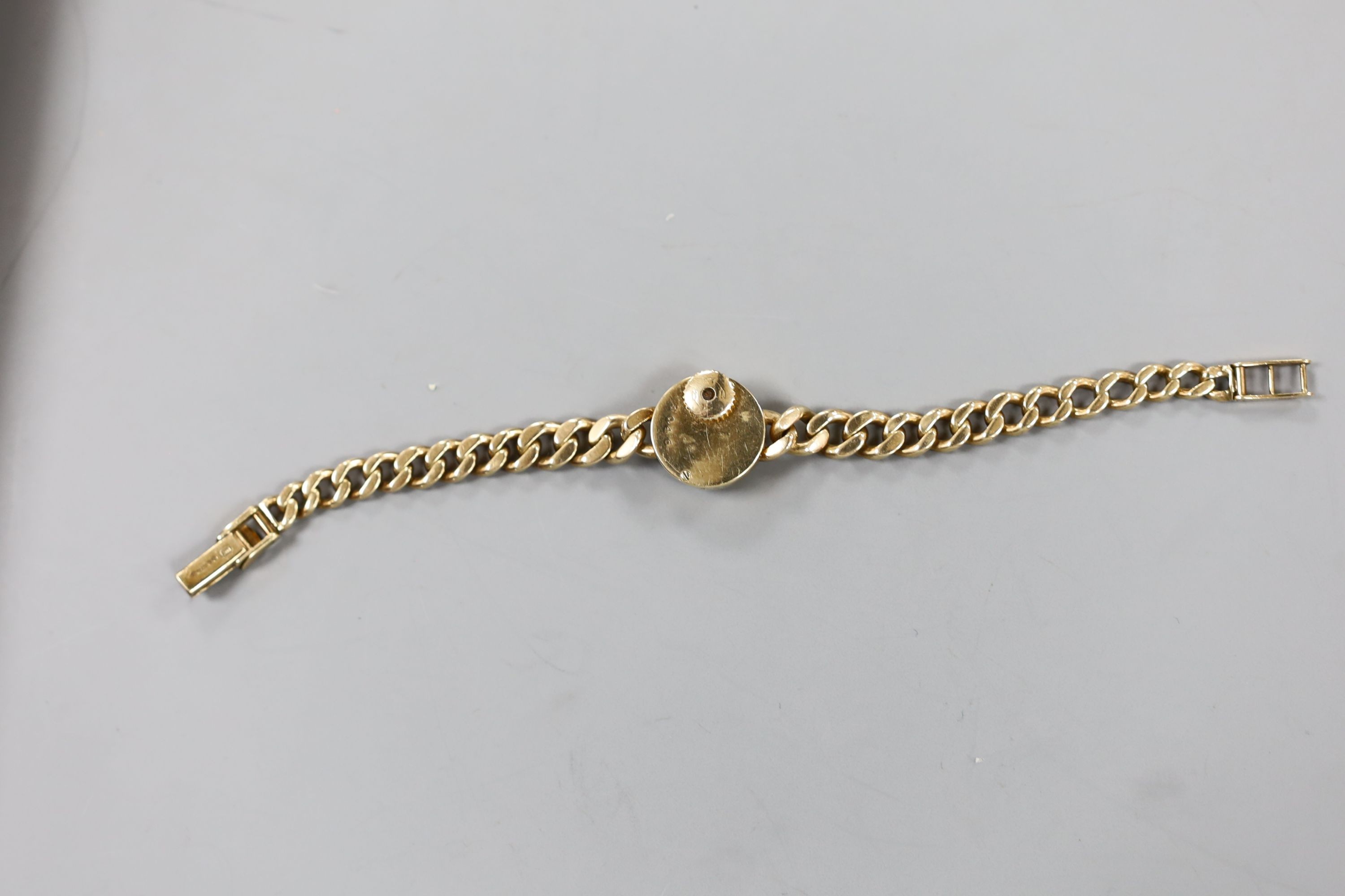 A lady's 1960's 9ct gold Jaeger Le Coultre back wind wrist watch, on a 9ct gold curb link bracelet